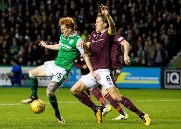 Hibs' Simon Murray and Hearts' Christophe Berra clash during an earlier encounter at Easter Road this season. Pic: SNS