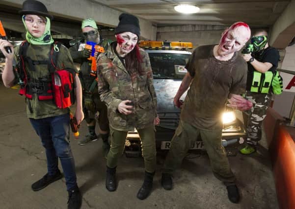Foam Dart Thunder event at Ocean Terminal . Zombies with Zombie car at Ocean Terminal before the start of the event  on Saturday night.