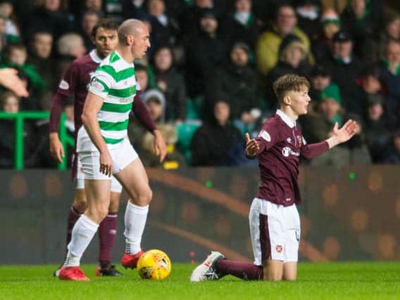 Celtic captain Scott Brown battled with Harry Cochrane before the Hearts teenager's injury