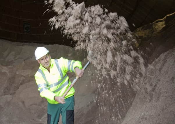Edinburgh Council's preparation for winter -
Fraser Stewart, a depot roadman, shovelling road salt