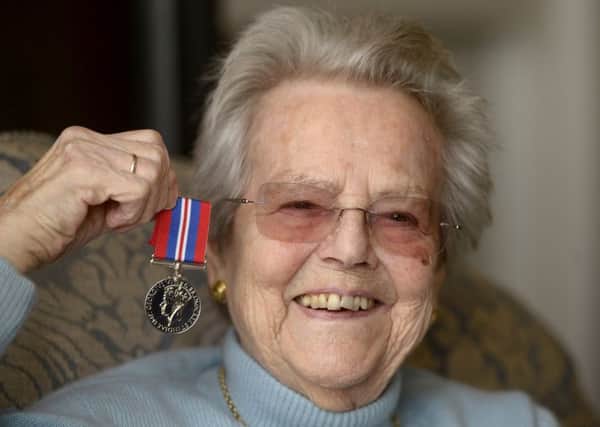 95-year-old Patsy Mundie was thrilled to receive her medal. Picture: Neil Hanna/ TSPL