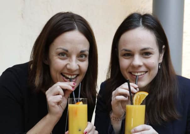MSPs Kezia Dugdale and Kate Forbes celebrate the Parliament's change