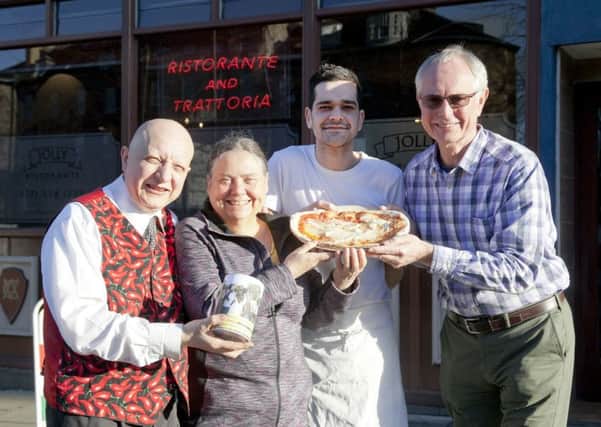 Vito Alongi and nephew Vito Vickers of the Jolly restaurant in Elm Row donate money from their pizzas to a charity run by John and Christine Carney. Picture: Alistair Linford