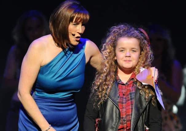 Saskia Eng, pictured with host Arlene Stuart,  winning Edinburgh Has Talent in 2013.  Picture: Ian Rutherford