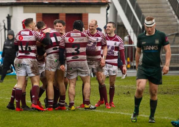 Watsonians celebrate one of their eight tries