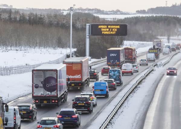 Traffic on the M8 Harthill in West Lothian. Scotland is covered in a blanket of snow, Picture: SWNS