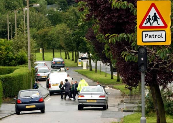 Flashing lights outside schools should be reinstated, despite the 20mph limit