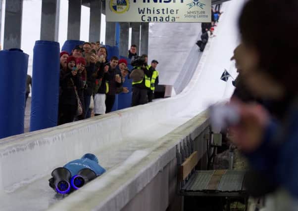 Royal Engineer and double amputee Micky Yule opn his winning skeleton run, Picture: SWNS