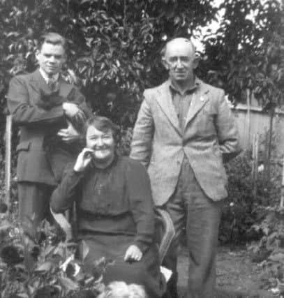 Bill, 17, (holding cat) with his 'aunty' Alice and 'uncle' Frank in 1945.