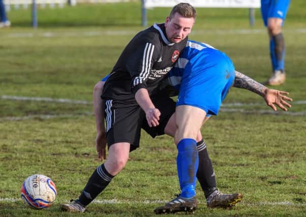 Broxburn's Scott Richards, left, tussles with Callum Connolly. Pic: Ian Georgeson