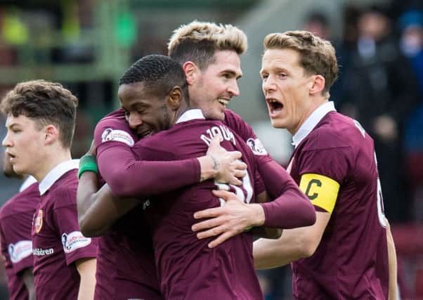 Kyle Lafferty, centre, grabbed a double as Hearts beat St Johnstone 3-0