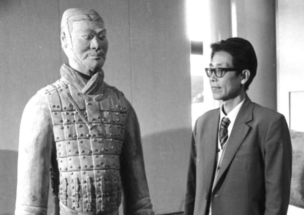 Yuan Zhong Yi, the Chinese archaeologist who excavated the Terracotta Army in the City Art Centre with one of the warriors which went on display in 1985. Picture: Ian Brand