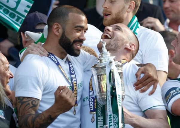 Liam Fontaine and David Gray celebrate with the Scottish Cup