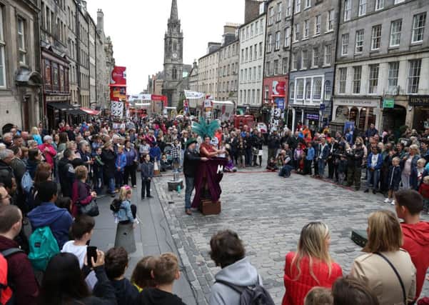 Street performers on the Royal Mile (Picture: PA)