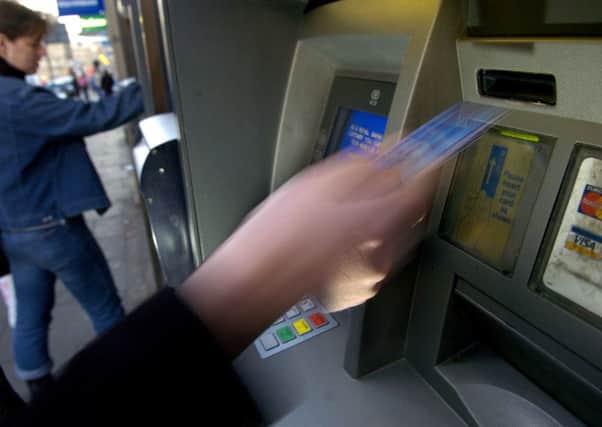There are fears for 30,000 free UK ATMs. Photograph: Ian Rutherford