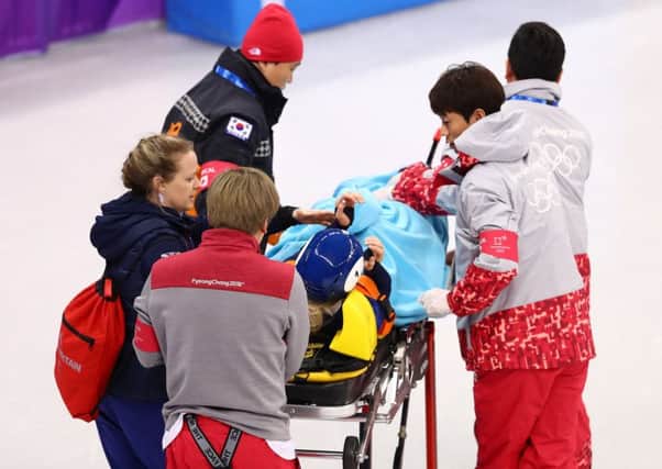 Elise Christie being carted off on a stretcher. Picture: Getty