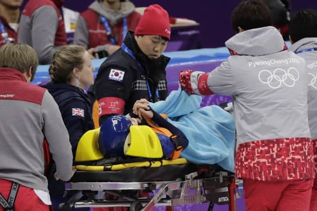 Elise Christie is transported from the ice on a stretcher after crashing. Picture; AP