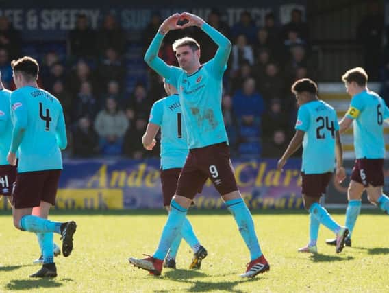 Kyle Lafferty celebrates his goal in front of around 700 Hearts fans in Dingwall