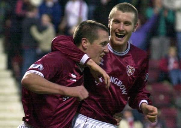 Hearts striker Andy Kirk, right, celebrates with Scott Severin