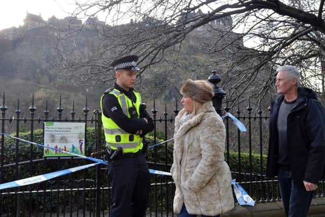 Officers guarded the entrances to Princes Street Gardens after the suspect package was destroyed. Picture: Jon Savage