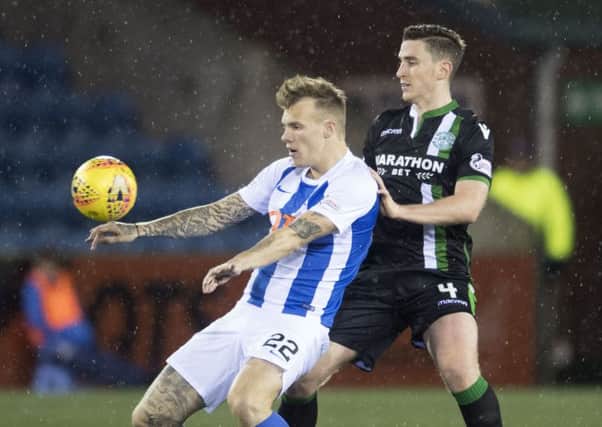 Kilmarnock's Lee Erwin shields the ball from Paul Hanlon when Hibs won 3-0 at Rugby Park last October