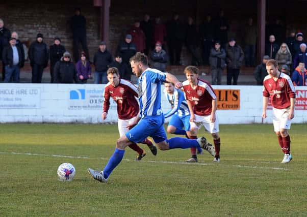 Penicuik's Andy Forbes fires home from the penalty spot. Pic: Jon Savage