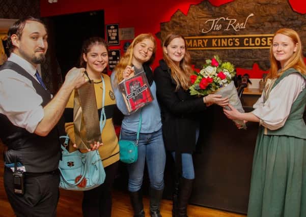 Staff members Keith Baxter and Jennifer Houston welcome McKenzie Grace, Adah Barenburg and Caroline Ross, from Naples as The Real Mary King's Close's 250,000th guests