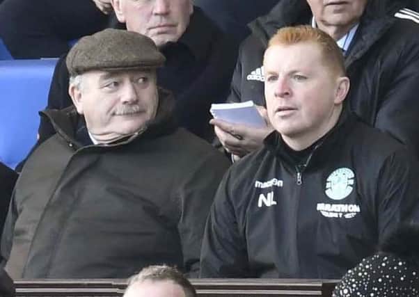 Hibs head coach Neil Lennon takes his place in the stand as chairman Rod Petrie looks on
