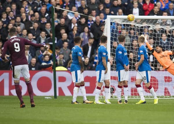 Kyle Lafferty nets a terrific free-kick in Hearts' defeat to Rangers back in October. Picture: SNS