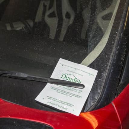 Leigh Griffiths arrived in his Range Rover that had a parking ticket on the windscreen, Picture: SWNS