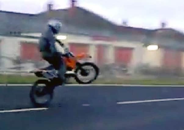 A still from a video of boy racers from Pilton riding motorbikes and quad bikes.