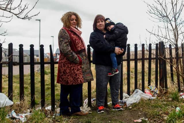 Jackie Drummond and her friend Catherine Mccolm. Catherine is with her Grandson Zander Moore (4). They are unhappy with the large amount of rubbish strewn around the area near Langlaw Road in Mayfield 26/2/18