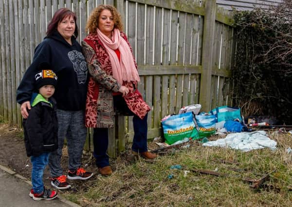 Catherine Mccolm. (Left) with her friend Jackie Drummond (R) Catherine is with her Grandson Zander Moore (4). They are unhappy with the large amount of rubbish strewn around the area near Langlaw Road in Mayfield 26/2/18