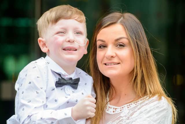 Paula Logan (Alex's mum) and little Alex Logan. Picture: Ian Georgeson