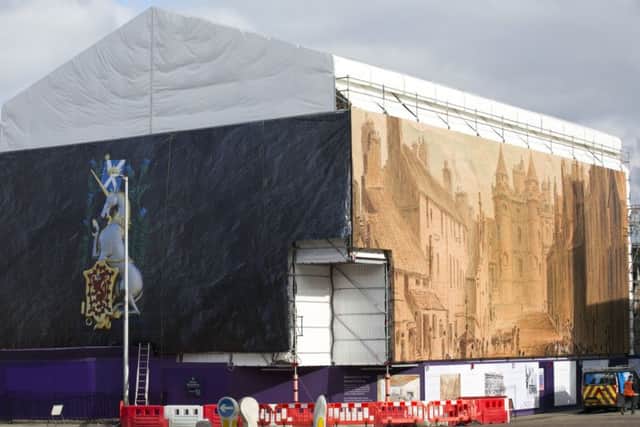 A nine-metre high decorative scaffold wrap is installed around the Abbey Strand building