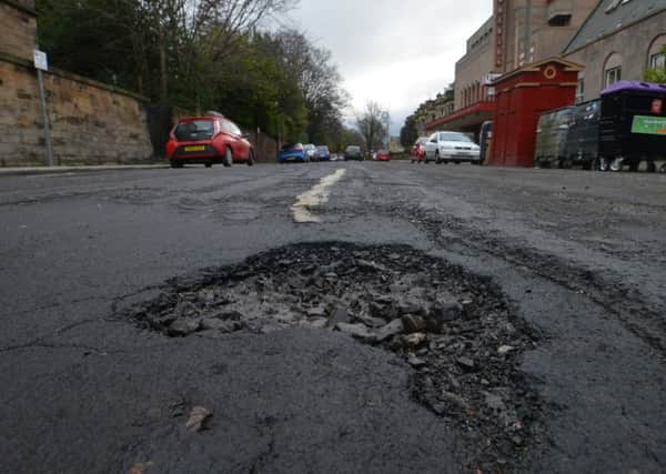 The city council seems to be unable to deal with holes all over the Capitals roads. Picture: Jon Savage