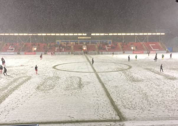 Snow covers the pitch at Forthbank