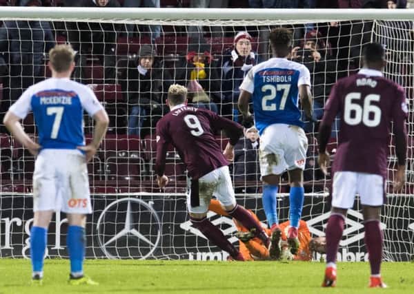 Kilmarnock goalkeeper Jamie MacDonald holds Kyle Lafferty's late penalty as Hearts were forced to settle for a draw. Pic: SNS