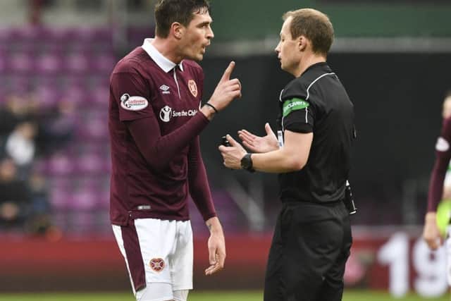 Hearts striker Kyle Lafferty will also want to avoid going into the referee's notebook. Pic: SNS