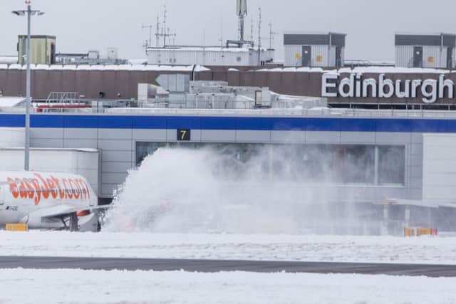 Snow ploughs out on the runway of Edinburgh Airport as planes are grounded and flights cancelled as the country is hit by the Beast from the East. March 1 2018
