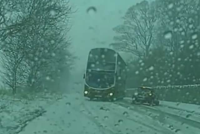 A screenshot of the dramatic moment a bus averted disaster
