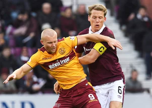 Hearts skipper Christophe Berra will face a tough task to contain Motherwell 
striker Curtis Main