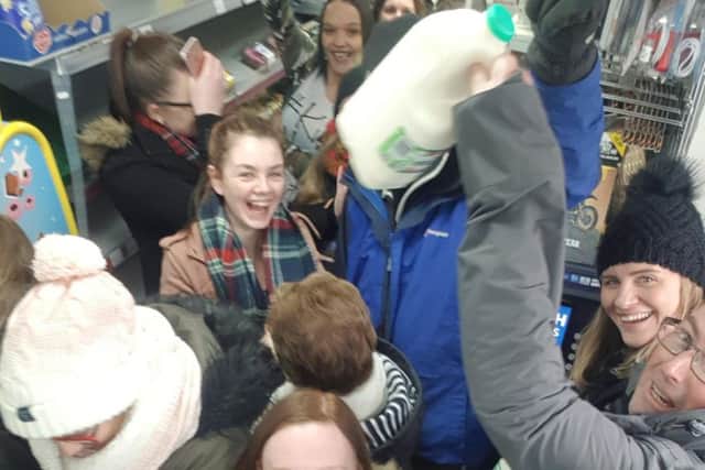 Delighted locals getting milk at Waz's in Broxburn. Picture: Scott Mooney