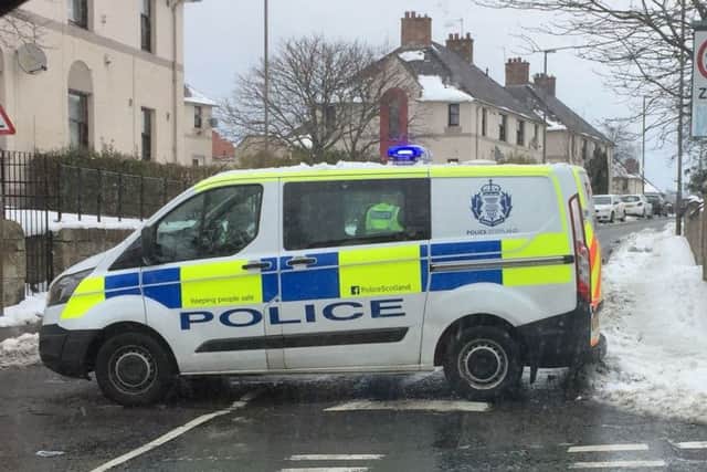 Police cordoned off a street in Dalkeith.