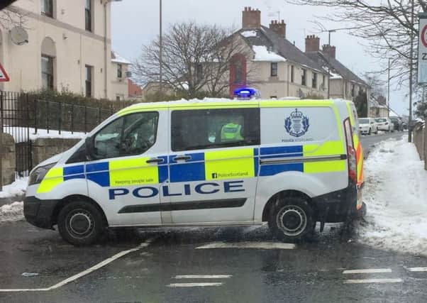 Police cordoned off a street in Dalkeith.