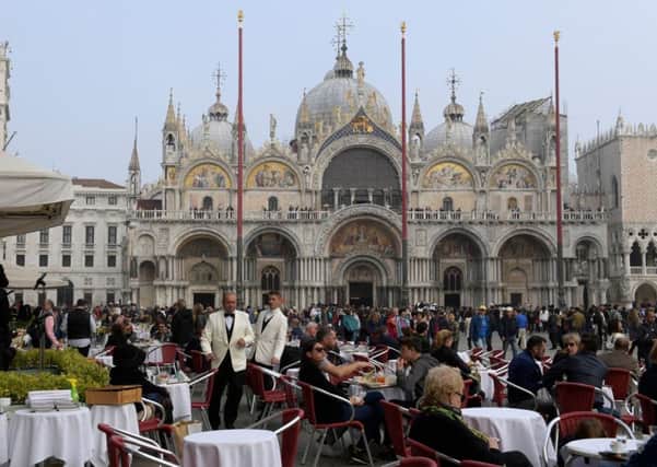 Tourists from all over the world flock to Venice, so much so that local Venetians are leaving in their thousands (Picture: AFP/Getty)