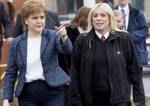 First Minister Nicola Sturgeon meets Lothian Bus driver Charmaine Laurie who steered her double-decker to avoid a car which lurched into her path in the snow. (Picture: SWNS)