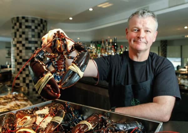 Roy Brett with some of the Lobsters he serves. Picture: Toby Williams