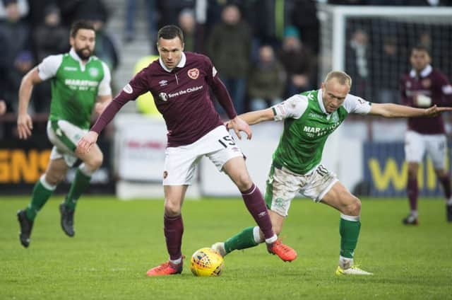 Don Cowie battles for the ball with Dylan McGeouch during the last meeting between the two teams. Picture: SNS Group