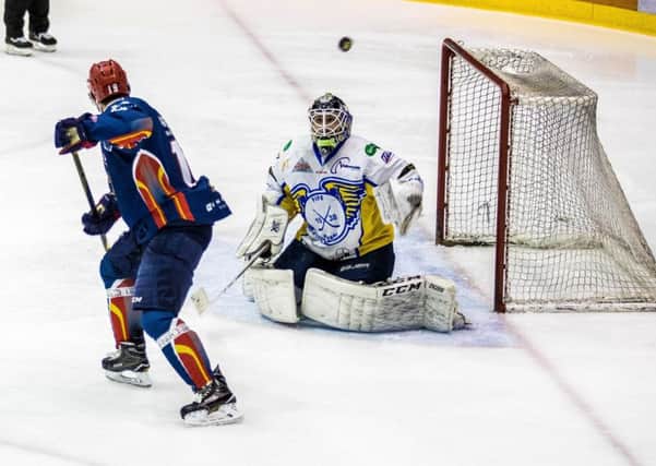 Dylan Anderson watches as a deflected puck flies over Jordan Marrs net. Pic: Ian Coyle